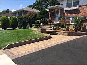 brown wave steps rockface rock face chiseled edge sahara chestnut brown walkway walk cambridge ledgestone asphalt light pier post planter